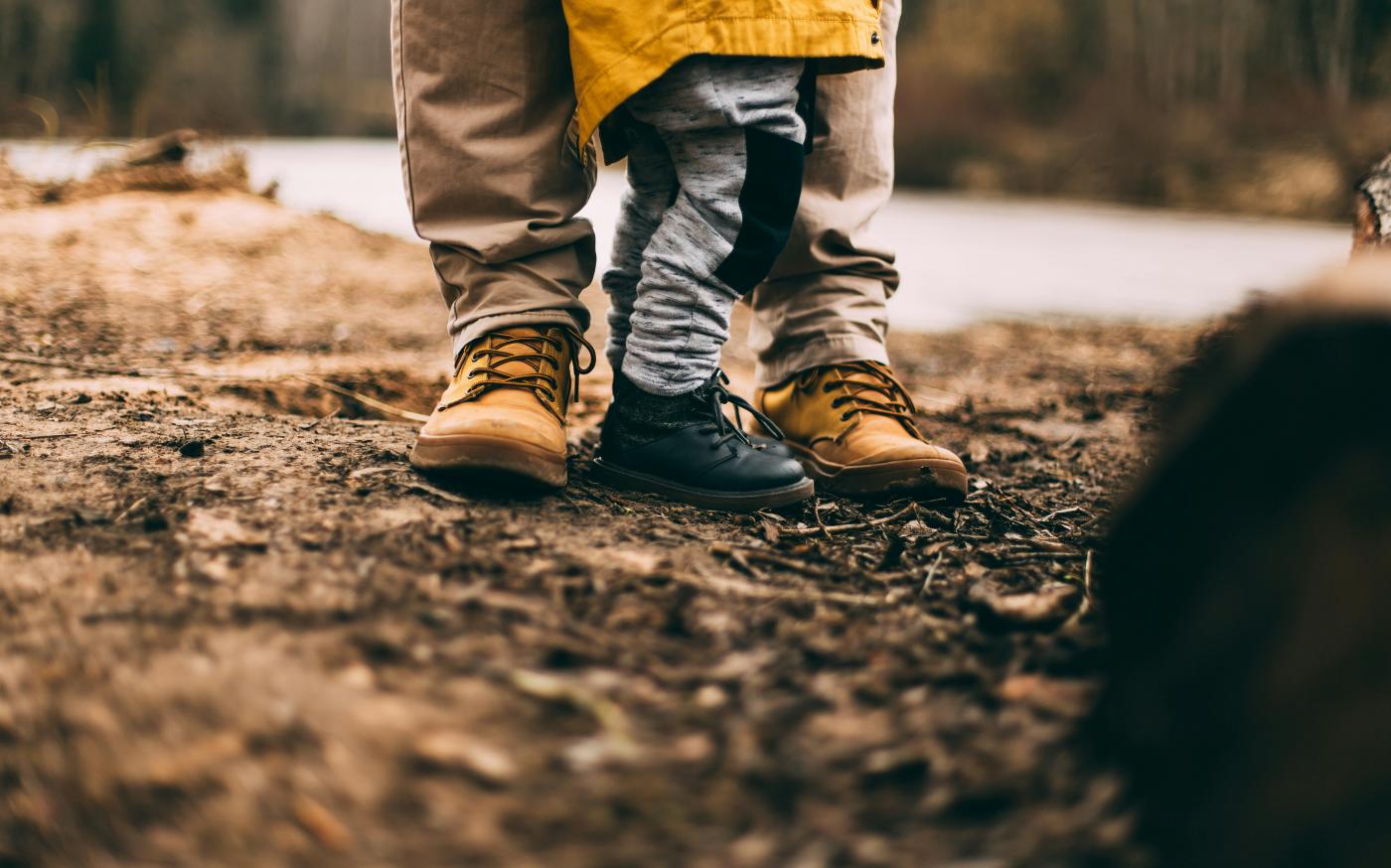 two person step on gray soil by Daiga Ellaby courtesy of Unsplash.