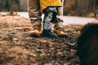 two person step on gray soil by Daiga Ellaby courtesy of Unsplash.