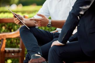 two people sitting during day by Medienstürmer courtesy of Unsplash.