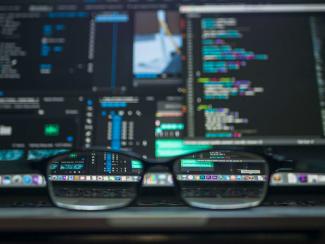 closeup photo of eyeglasses by Kevin Ku courtesy of Unsplash.